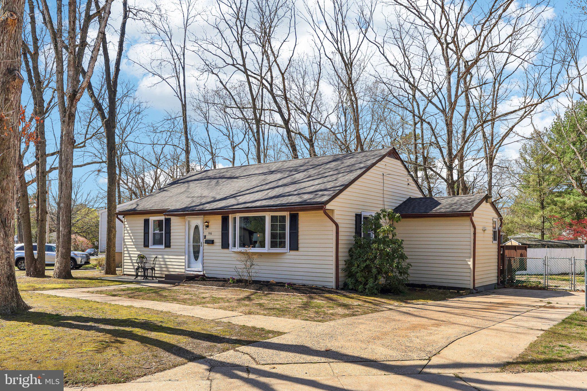 96 East 9th Avenue Pine Hill, NJ 08021 - Photo 30 of 31 a view of a white house with a large tree