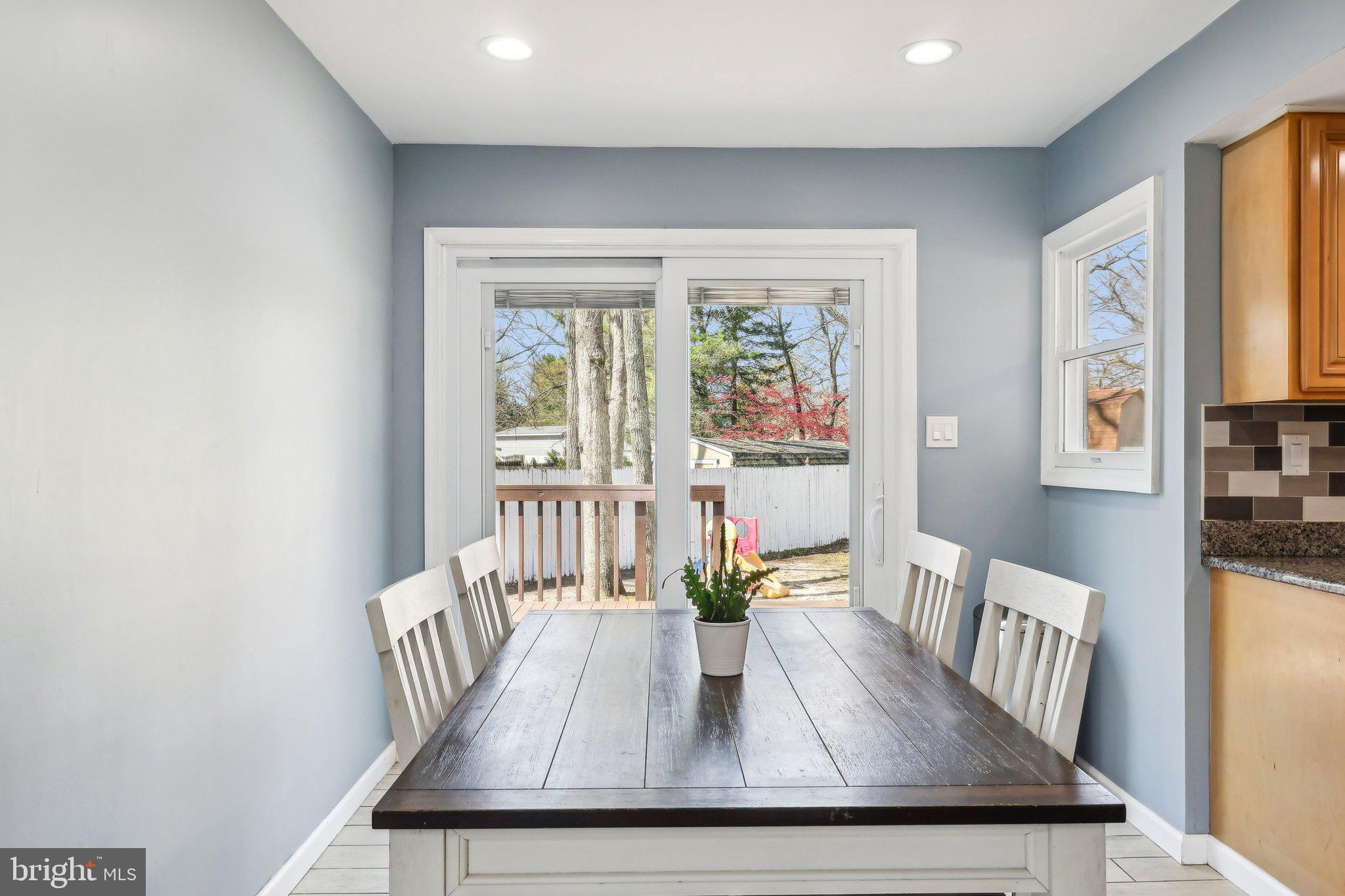 96 East 9th Avenue Pine Hill, NJ 08021 - Photo 6 of 31 a view of a dining room with furniture window and wooden floor