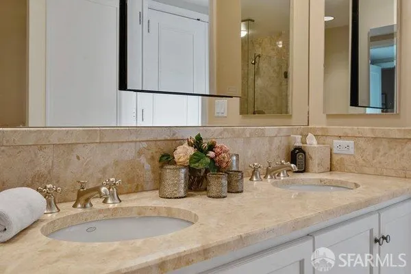 a bathroom with sink and mirror