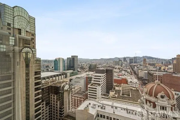 a view of a city with tall buildings