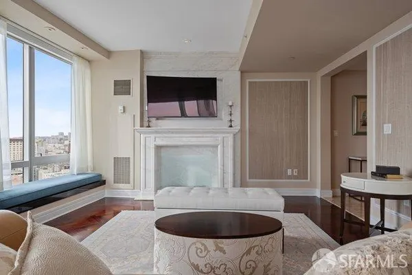 a living room with furniture and a fireplace