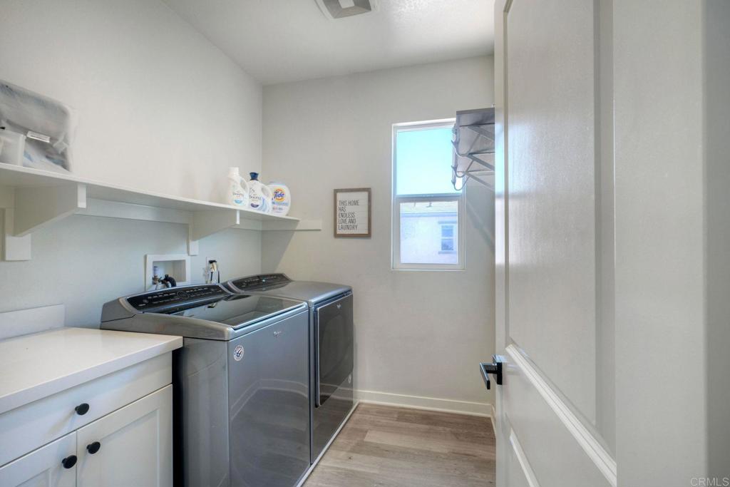 4141 Mission Tree Way Oceanside, CA 92057 - Photo 24 of 29 How convenient to have the laundry room on the second floor.