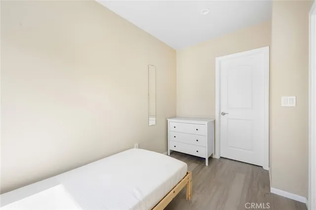 a room with a bed and cabinet