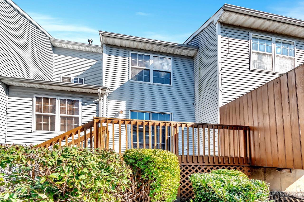 5 Rondell Lane, Unit 198 Old Bridge, NJ 08879 - Photo 21 of 23 a view of a house with a wooden fence