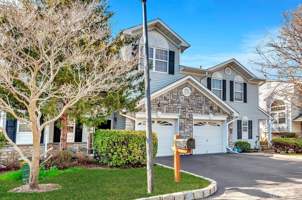 5 Rondell Lane, Unit 198 Old Bridge, NJ 08879 - Photo 3 of 23 a front view of a house with a yard