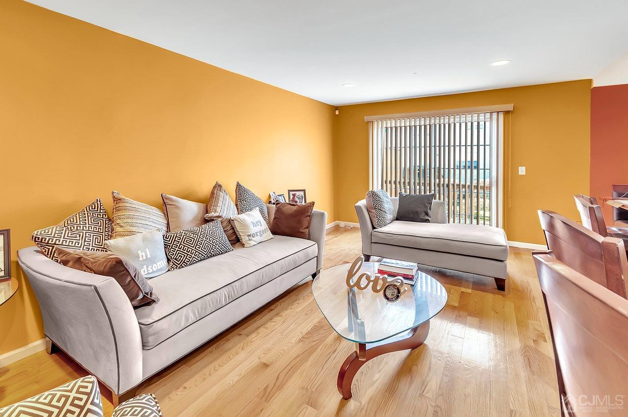 5 Rondell Lane, Unit 198 Old Bridge, NJ 08879 - Photo 7 of 23 a living room with furniture and a large window