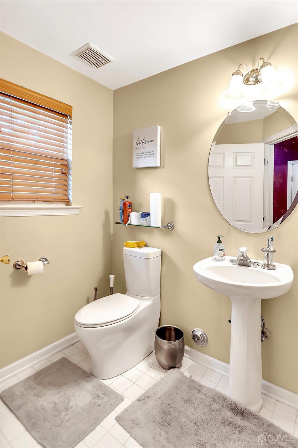 5 Rondell Lane, Unit 198 Old Bridge, NJ 08879 - Photo 10 of 23 a bathroom with a sink toilet and mirror