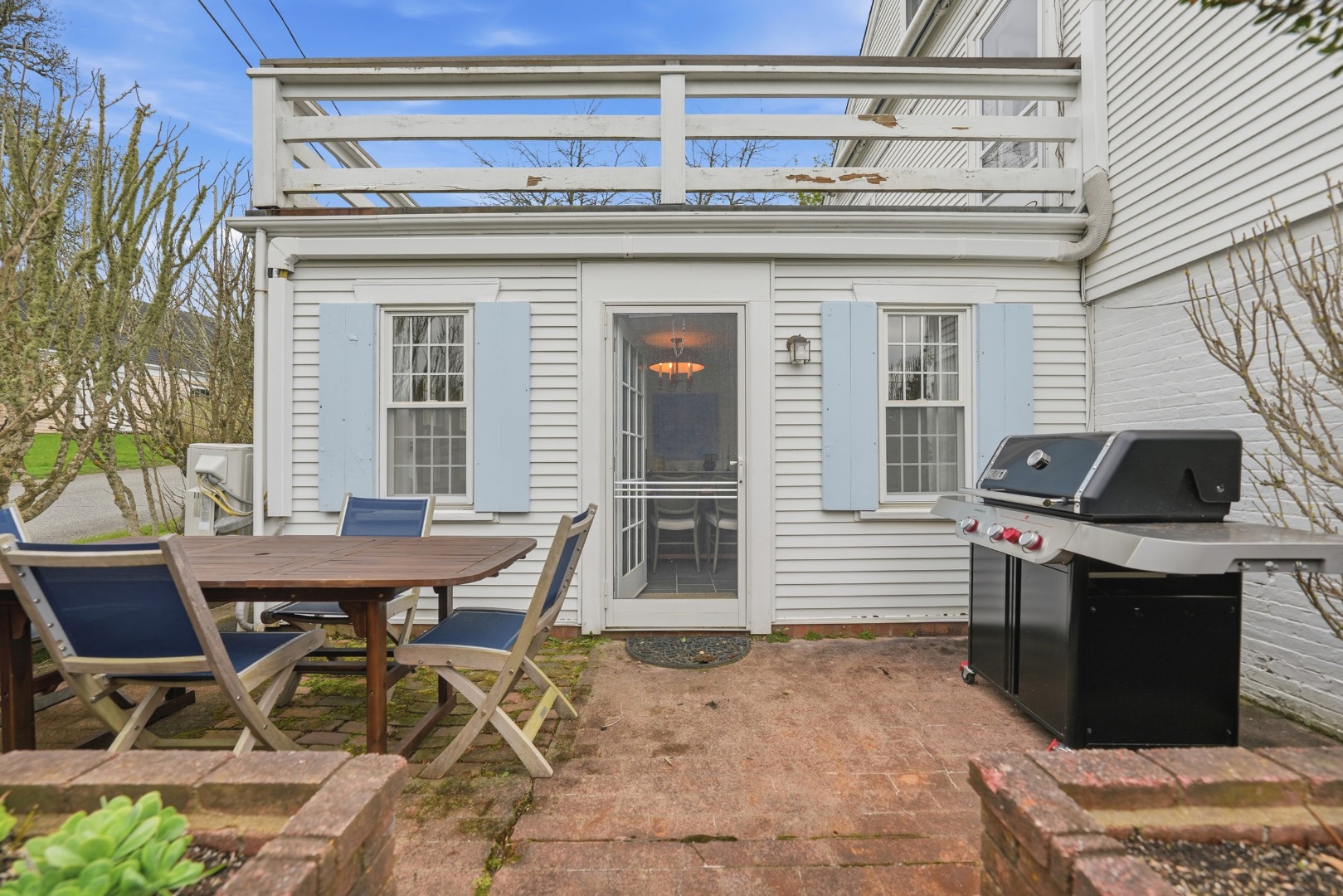 8 Atwood Circle Edgartown, MA 02539 - Photo 27 of 33 a view of a dinning table and chairs in the patio