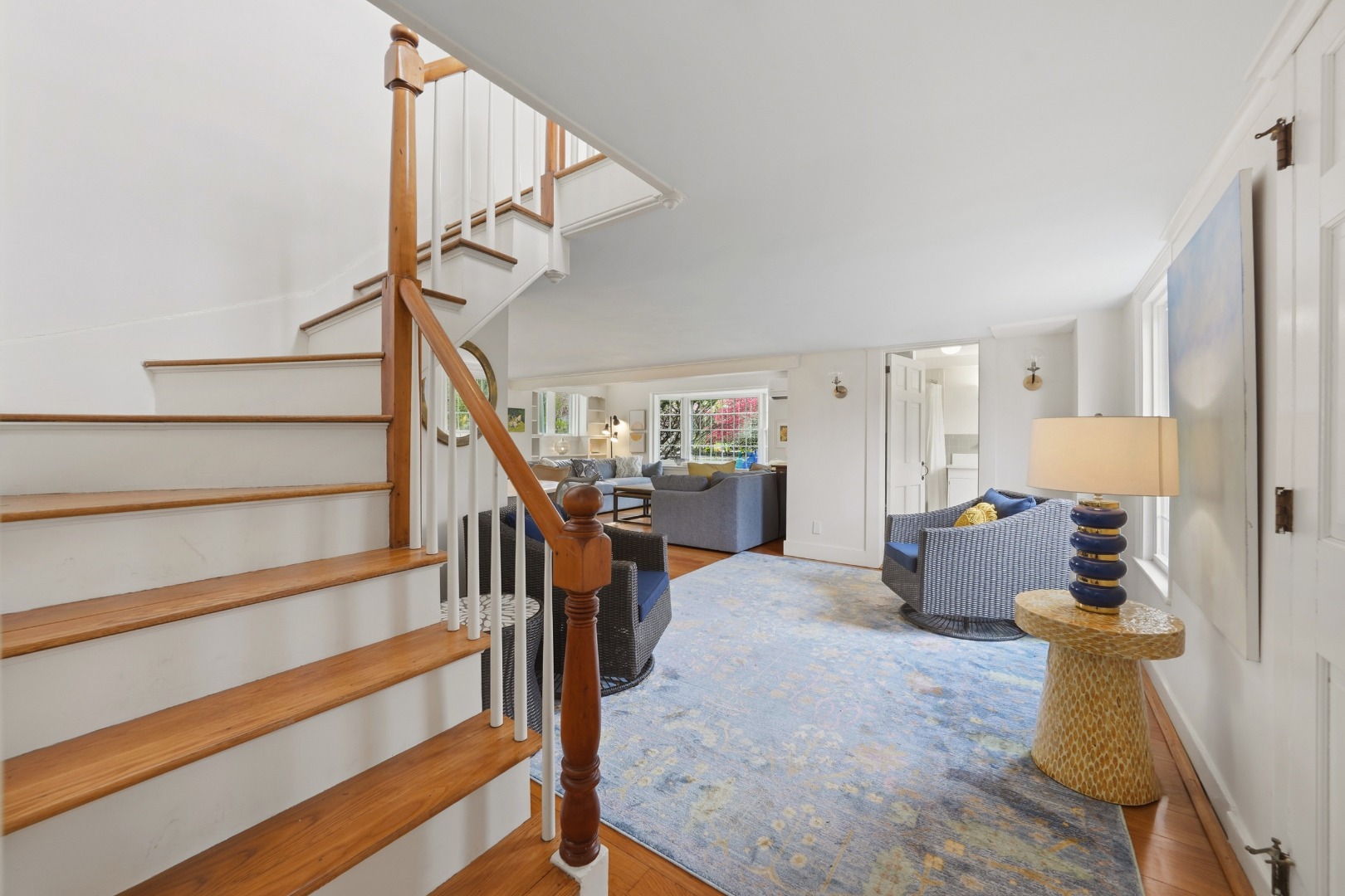 8 Atwood Circle Edgartown, MA 02539 - Photo 5 of 33 a living room with furniture and a chandelier
