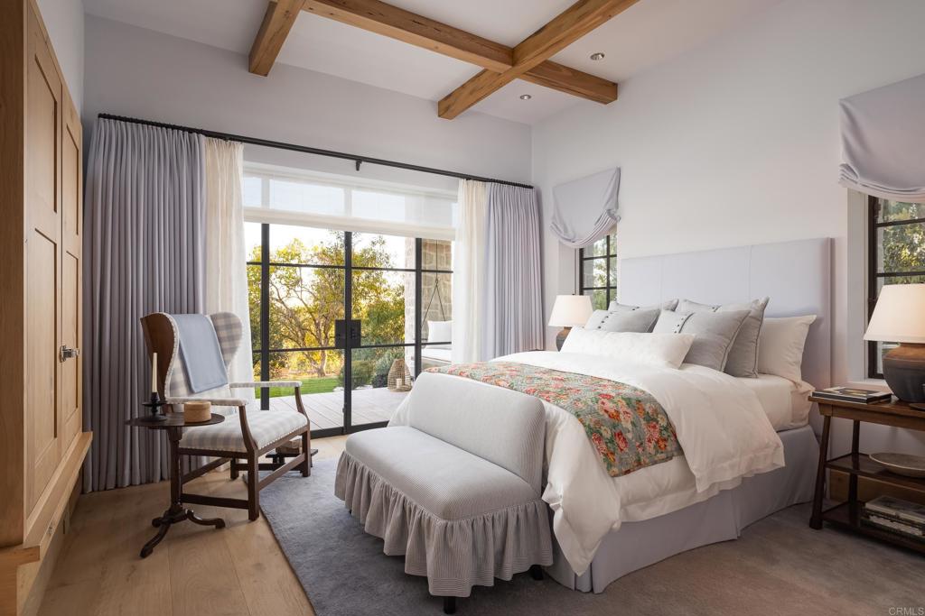 17845 Via De Fortuna Rancho Santa Fe, CA 92067 - Photo 37 of 45 a bedroom with a bed and a window