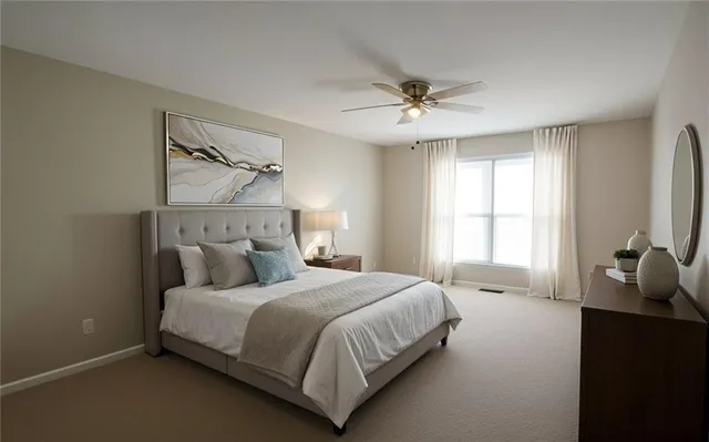 a bedroom with a bed and window