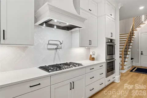 a kitchen with appliances cabinets and a counter top space
