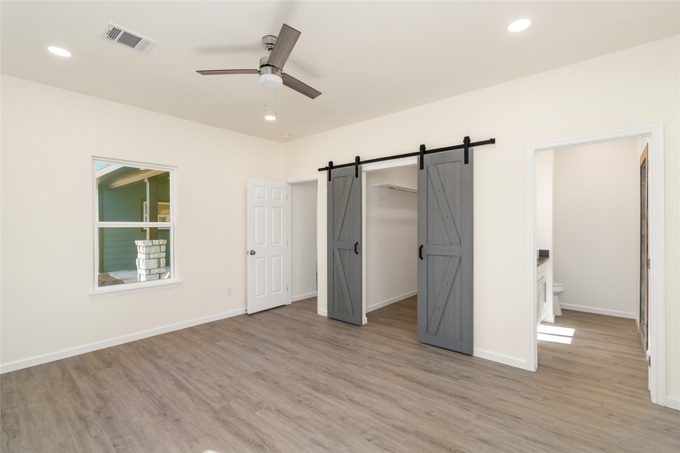 4656 North Teague Street Rosharon, TX 77583 - Photo 26 of 41 Stylish sliding barn door adds character and modern farmhouse flair.