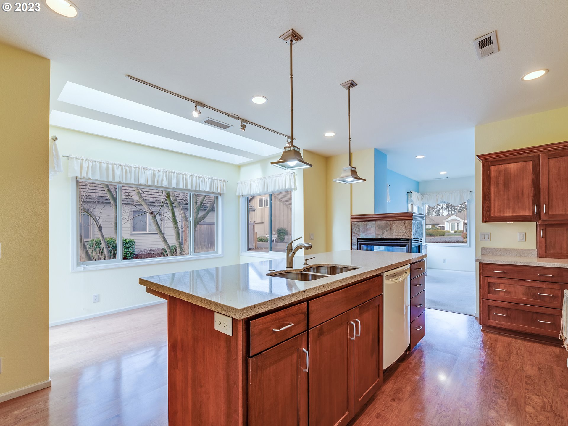 2006 Lakeland Way Eugene, OR 97408 - Photo 5 of 32 a kitchen with kitchen island granite countertop a sink appliances and cabinets