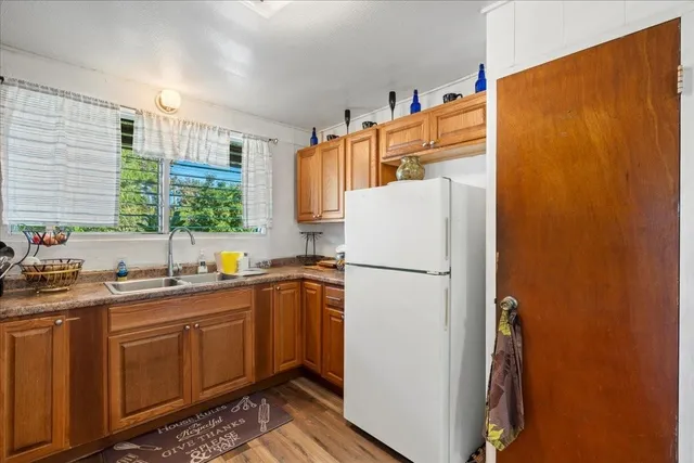 a kitchen with a sink stove and microwave