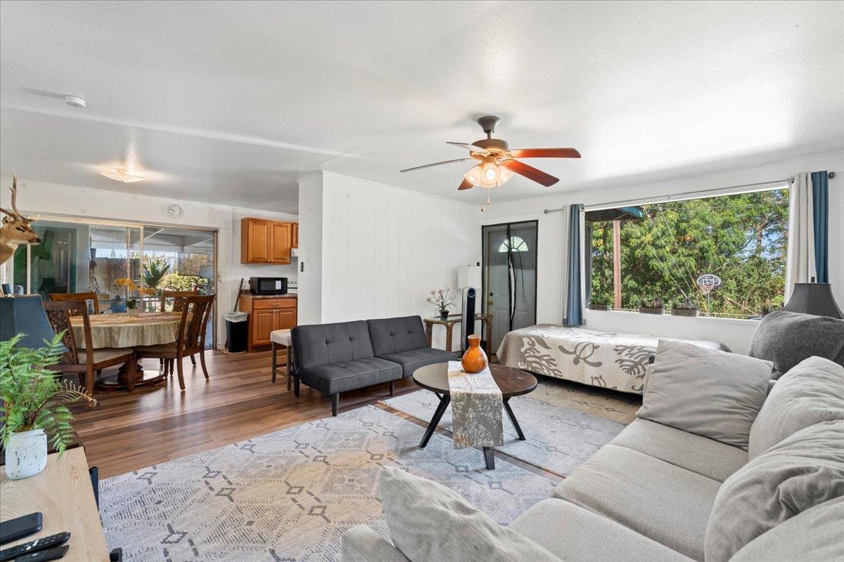 2226 Lilikoi Road Haiku, HI 96708 - Photo 22 of 50 a living room with furniture and a large window