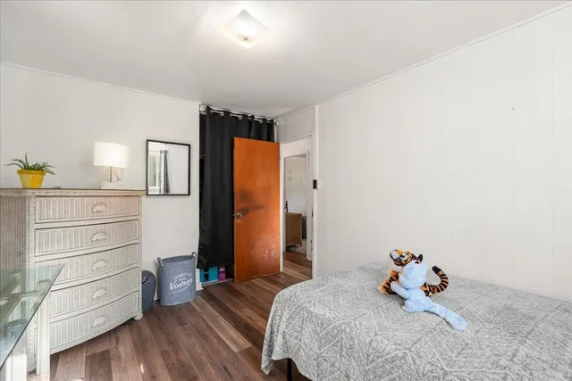 a bedroom with bed and window