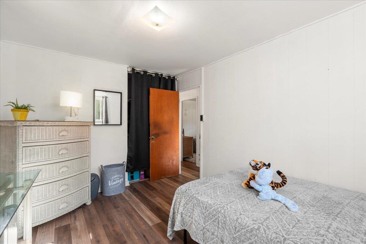 2226 Lilikoi Road Haiku, HI 96708 - Photo 26 of 50 a bedroom with a bed and wooden floor