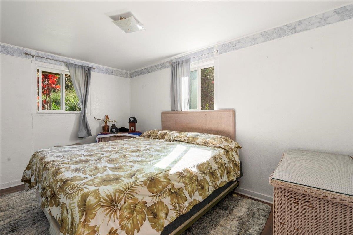 2226 Lilikoi Road Haiku, HI 96708 - Photo 27 of 50 a bedroom with bed and window