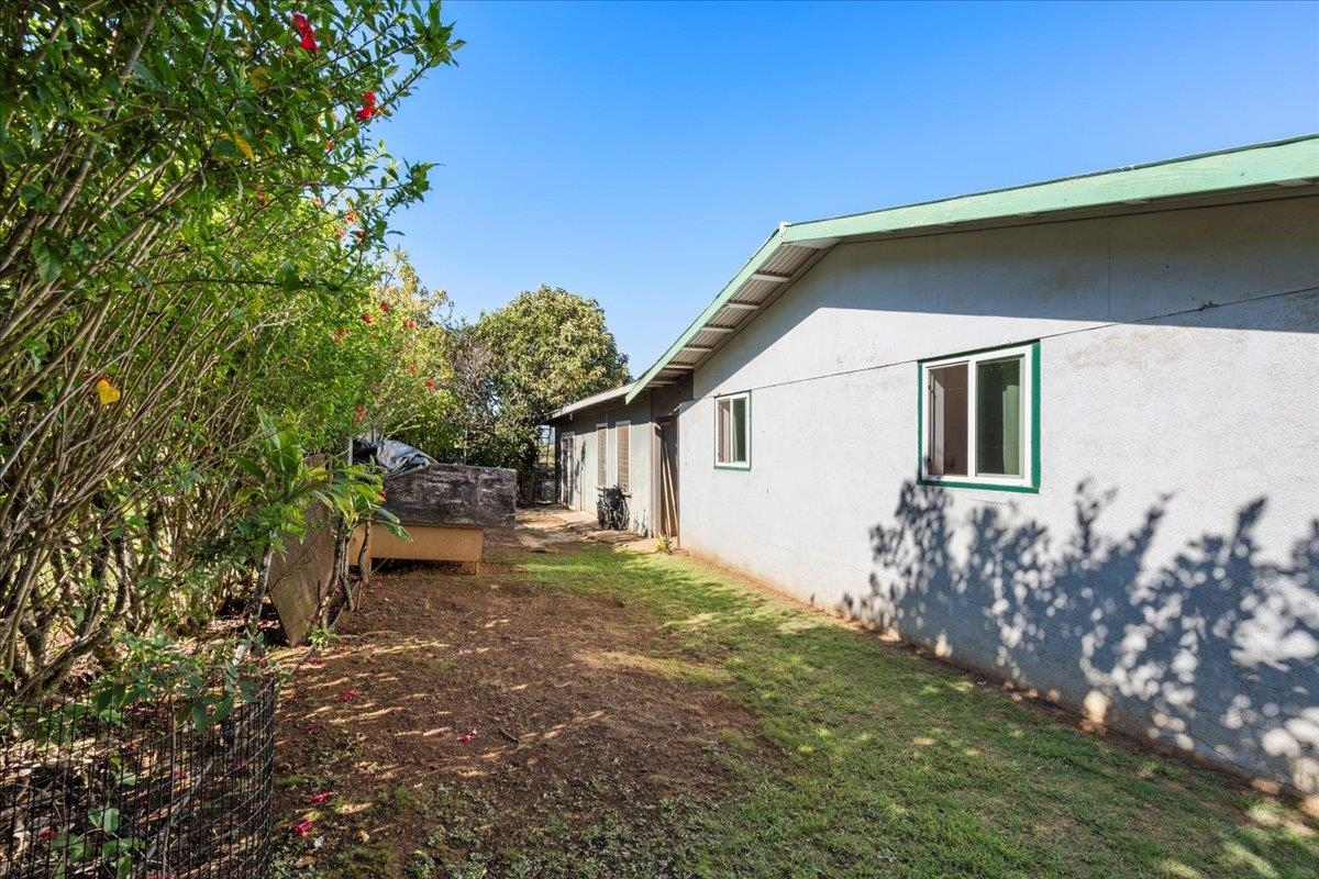 2226 Lilikoi Road Haiku, HI 96708 - Photo 32 of 50 a backyard of a house with table and chairs
