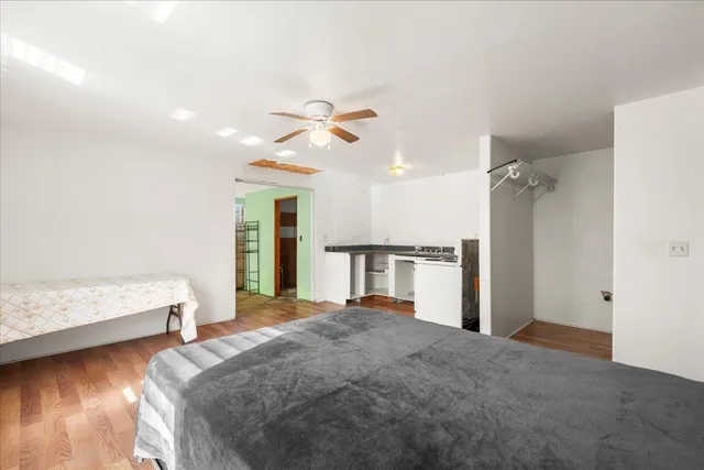 a living room with a bed furniture and a window