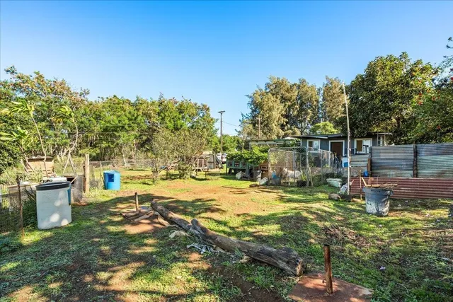 a view of a big yard with an outdoor space