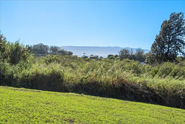 a view of lake with mountain in the background