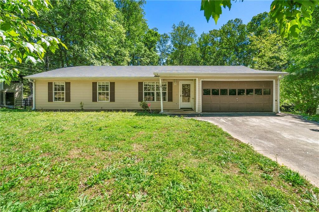 299 Clyde Cole Road Dallas, GA 30157 - Photo 1 of 1 a house with huge green field in front of it