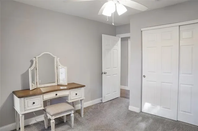 a room with a table and chandelier