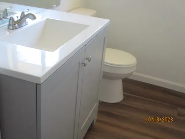 a bathroom with a toilet and a sink
