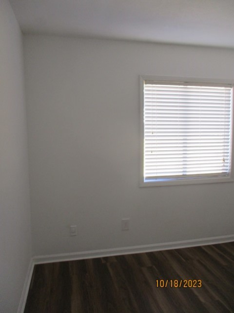 6120 Miller Road Columbus, GA 31907 - Photo 24 of 27 a view of an empty room with wooden floor and a window