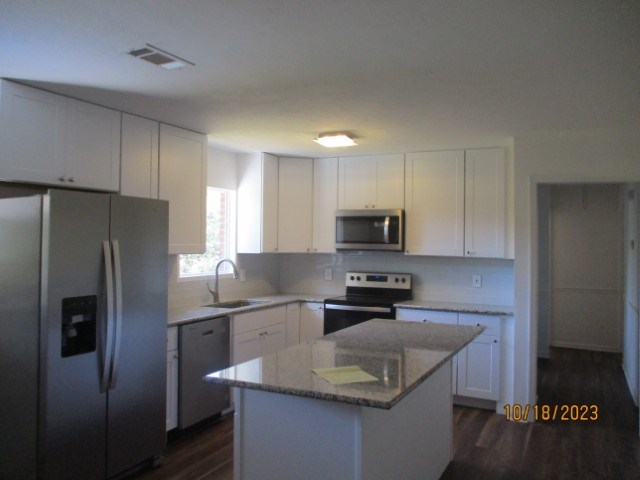 6120 Miller Road Columbus, GA 31907 - Photo 6 of 27 a kitchen with stainless steel appliances granite countertop a sink stove refrigerator and microwave