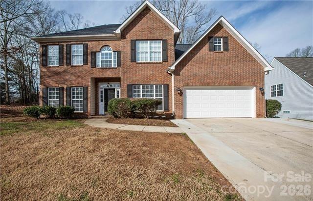 815 Knightsbridge Road Fort Mill, SC 29708 - Photo 1 of 30 a front view of a house with a yard and garage
