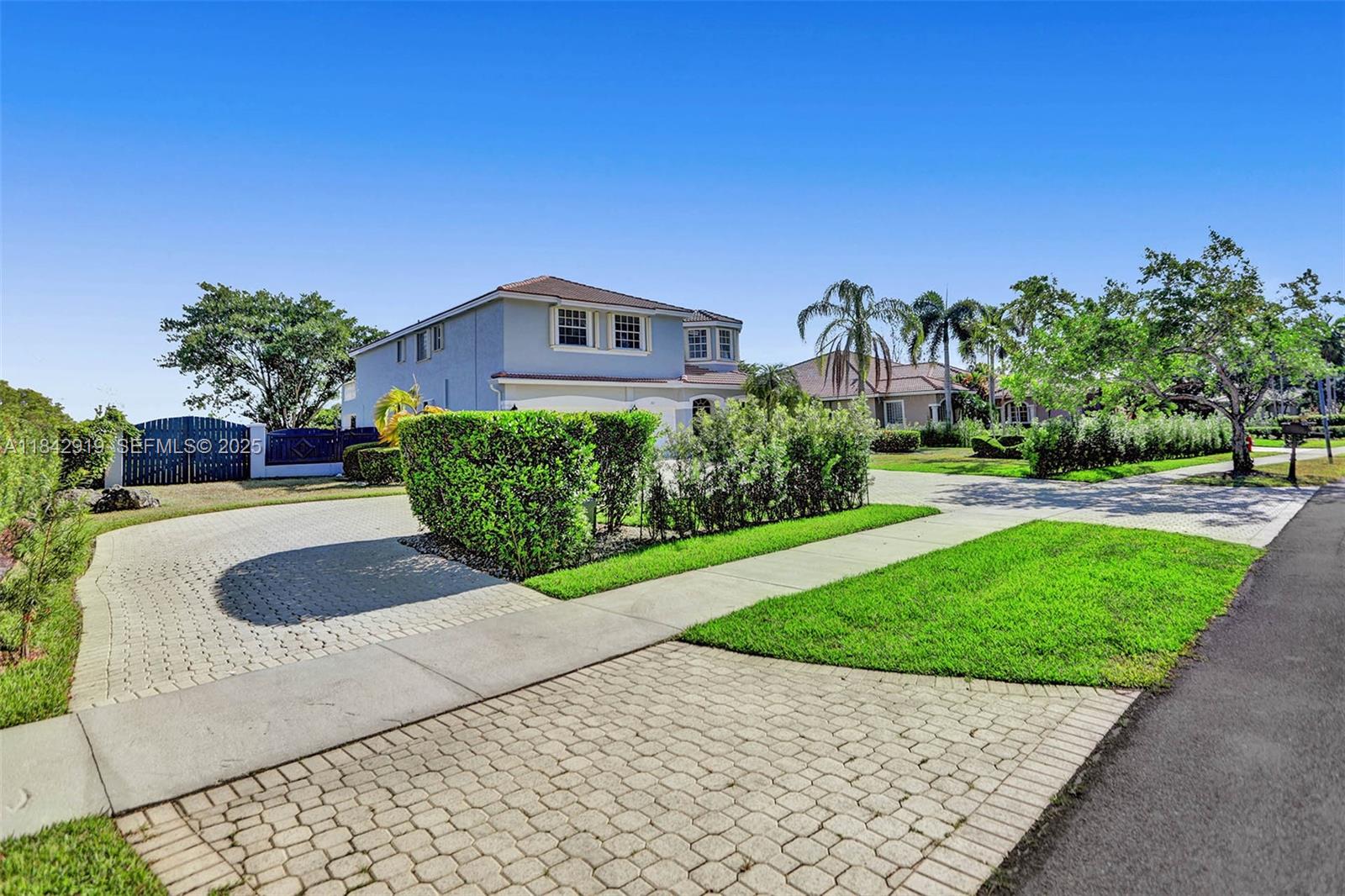 721 Ranch Road Weston, FL 33326 - Photo 4 of 38 a view of a house with a yard
