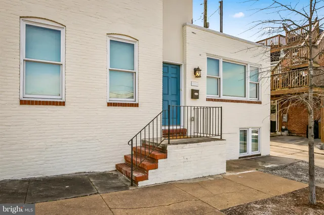 front view of a house with a small yard