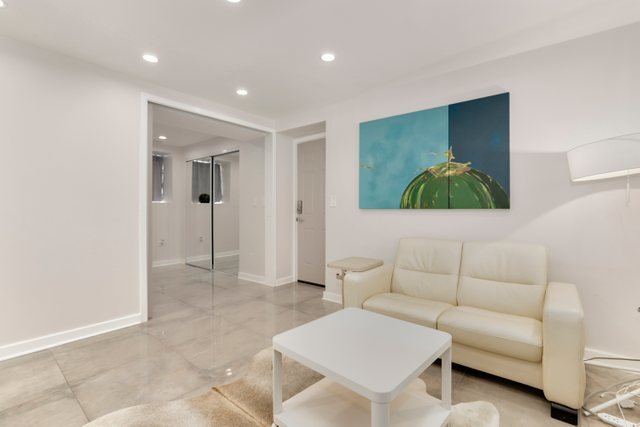 3604 West George Street, Unit G Chicago, IL 60618 - Photo 3 of 19 a living room with furniture and a flat screen tv