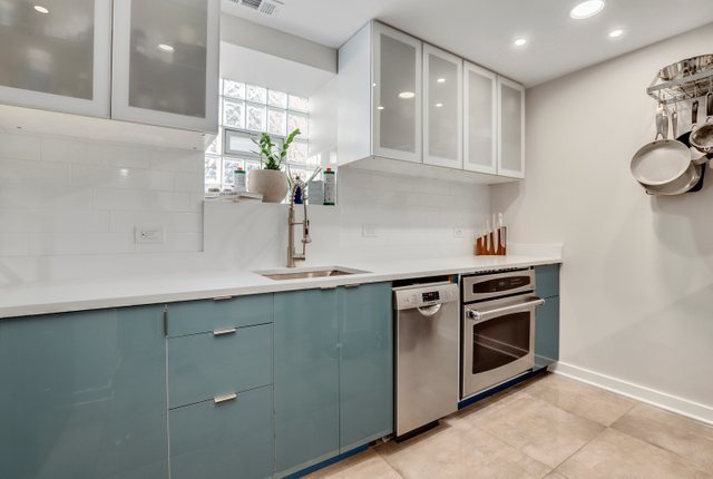 3604 West George Street, Unit G Chicago, IL 60618 - Photo 7 of 19 a kitchen with stainless steel appliances a sink stove and cabinets