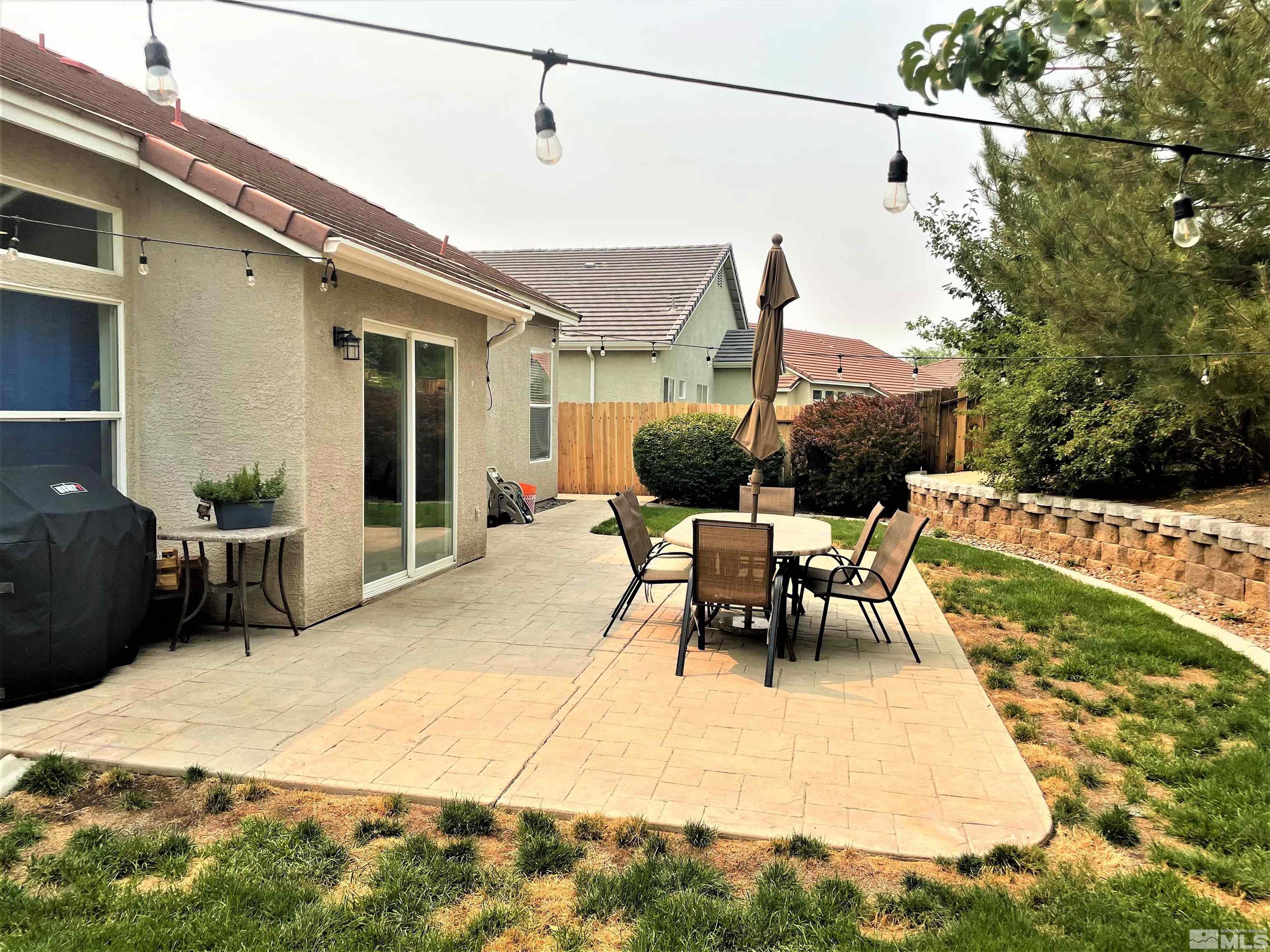 1710 Canyonlands Way Reno, NV 89521 - Photo 25 of 28 a view of a patio with a table and chairs