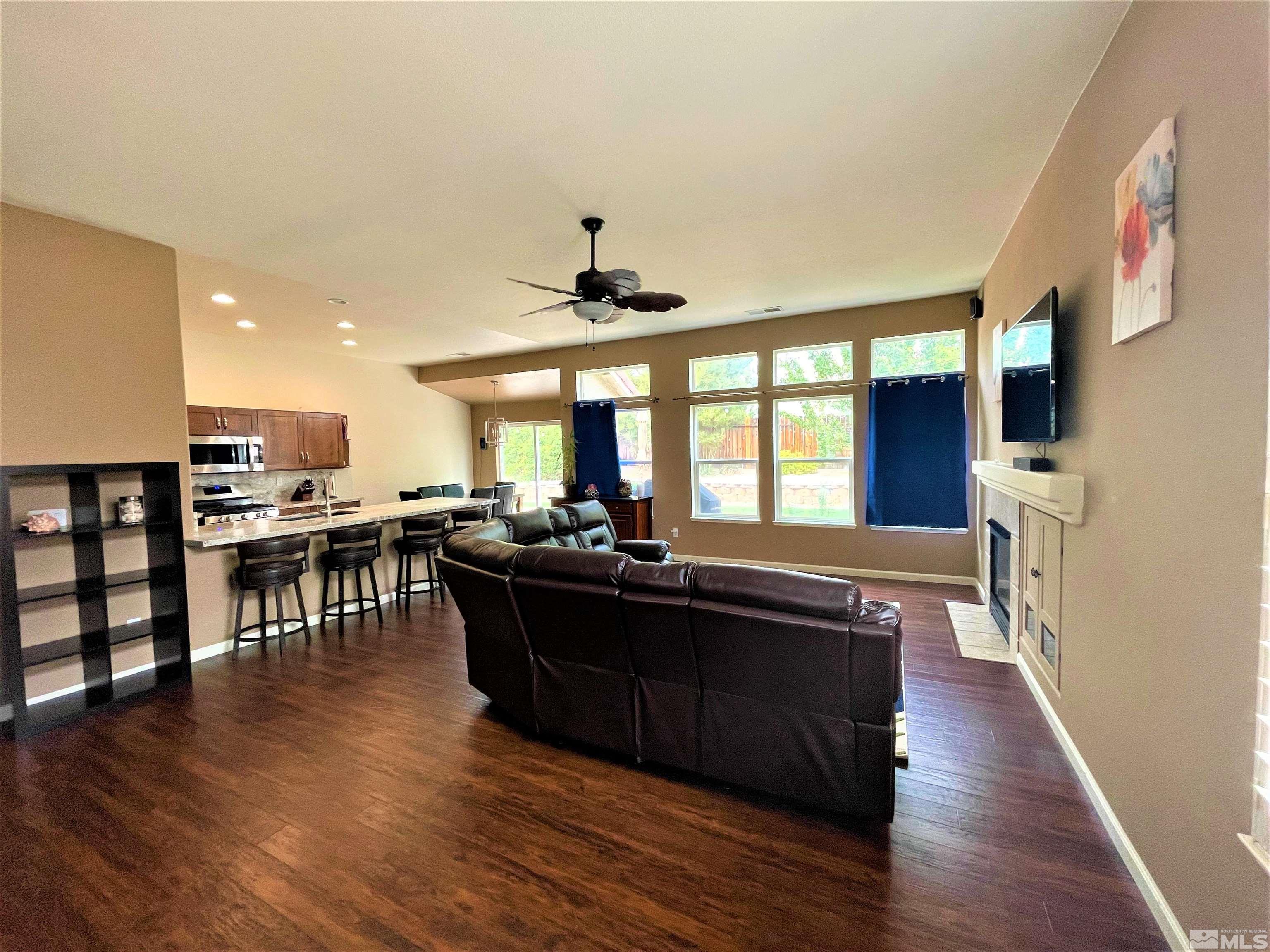 1710 Canyonlands Way Reno, NV 89521 - Photo 8 of 28 a view of a dining room with furniture window and wooden floor