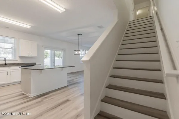 a view of entryway and kitchen