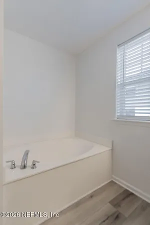 a view of a room that has a window in it