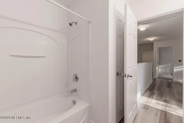 a bathroom with a bathtub and a sink