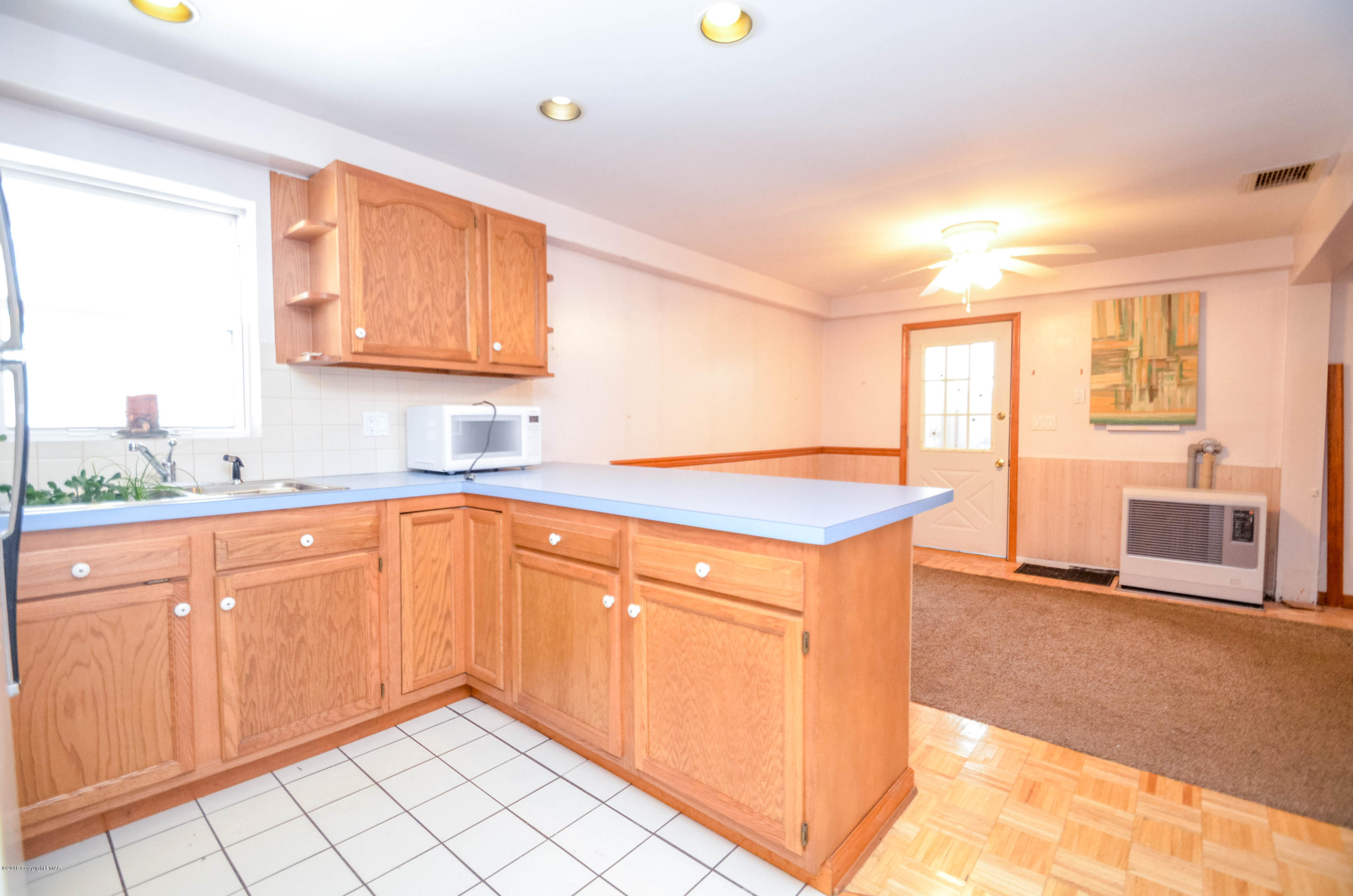 4126 Romeo Road Tobyhanna, PA 18466 - Photo 16 of 22 a kitchen with stainless steel appliances granite countertop a sink and a stove next to a window