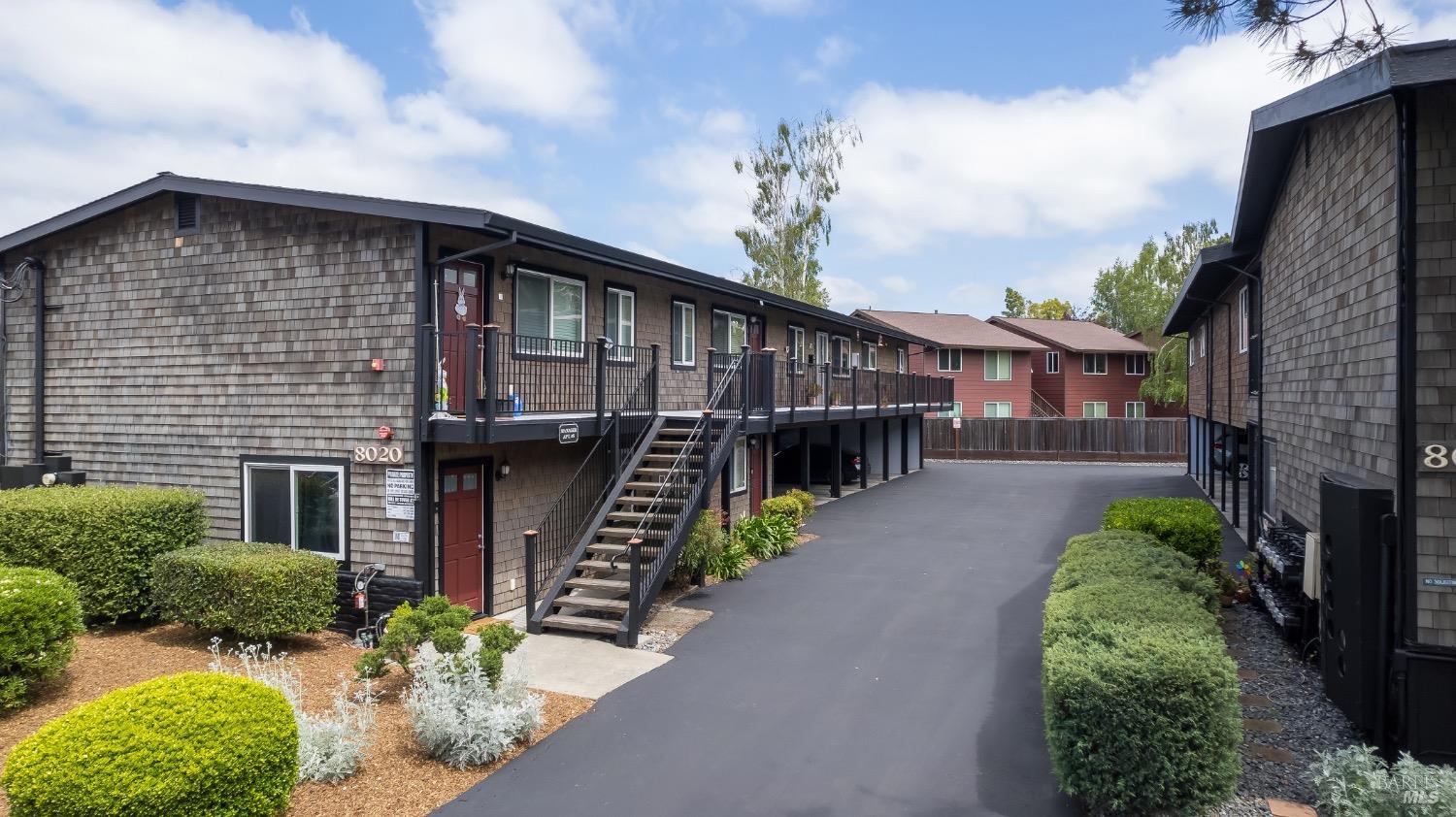 a house with lots of trees in the background