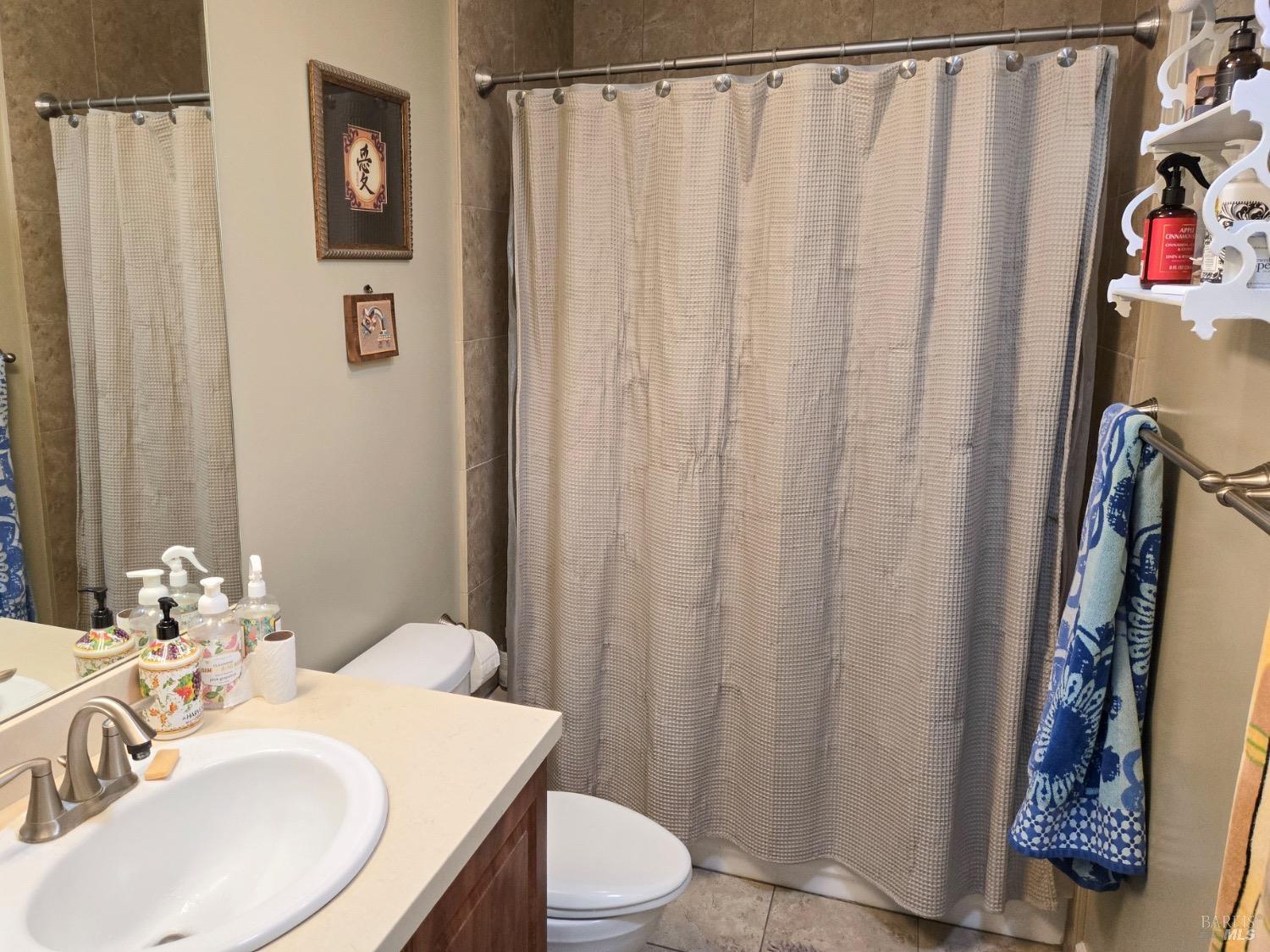 8020 Beverly Drive Rohnert Park, CA 94928 - Photo 27 of 35 a bathroom with a sink and a mirror