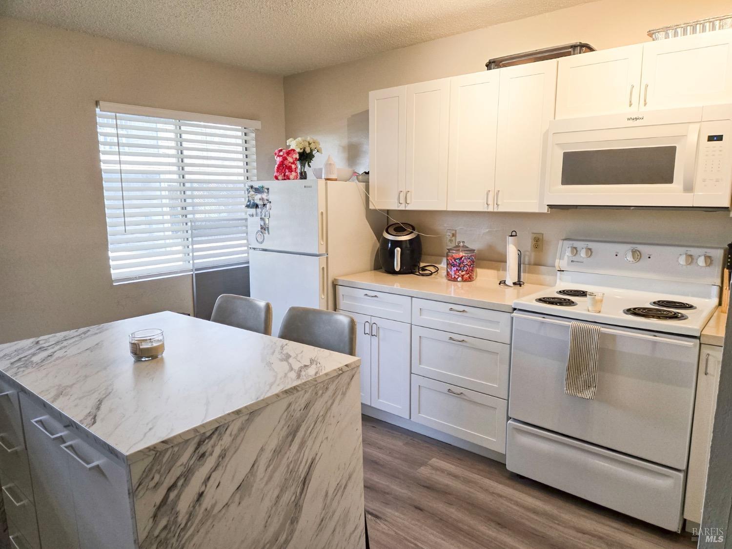 8020 Beverly Drive Rohnert Park, CA 94928 - Photo 34 of 35 a kitchen with a stove a sink and a microwave