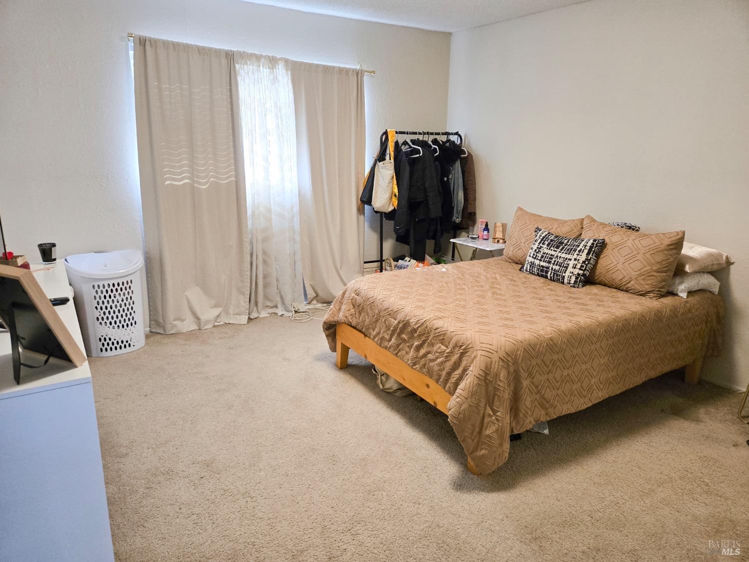 8020 Beverly Drive Rohnert Park, CA 94928 - Photo 35 of 35 a bedroom with a bed and a chair