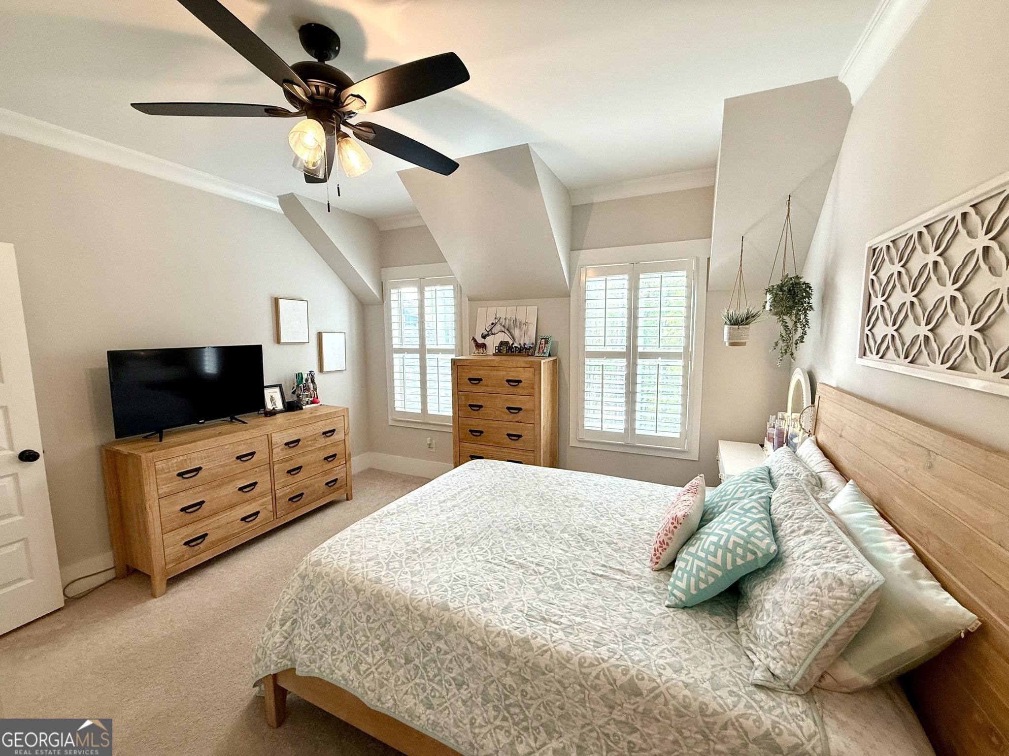 120 Spring Creek Drive Rutledge, GA 30663 - Photo 30 of 38 a bedroom with a bed a flat screen tv on dresser and a window