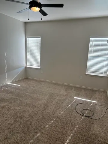 a view of a air conditioner and window in a room