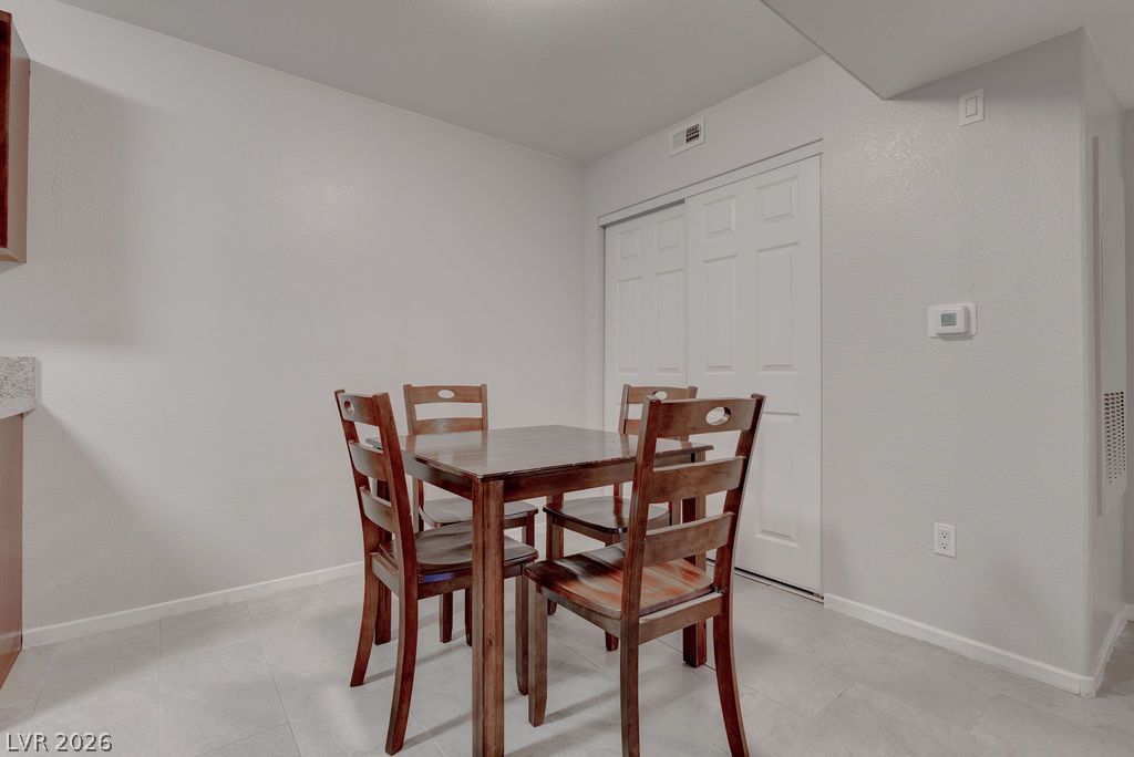 7885 West Flamingo Road, Unit 1016 Las Vegas, NV 89147 - Photo 6 of 24 A compact dining area provides a casual spot for meals.